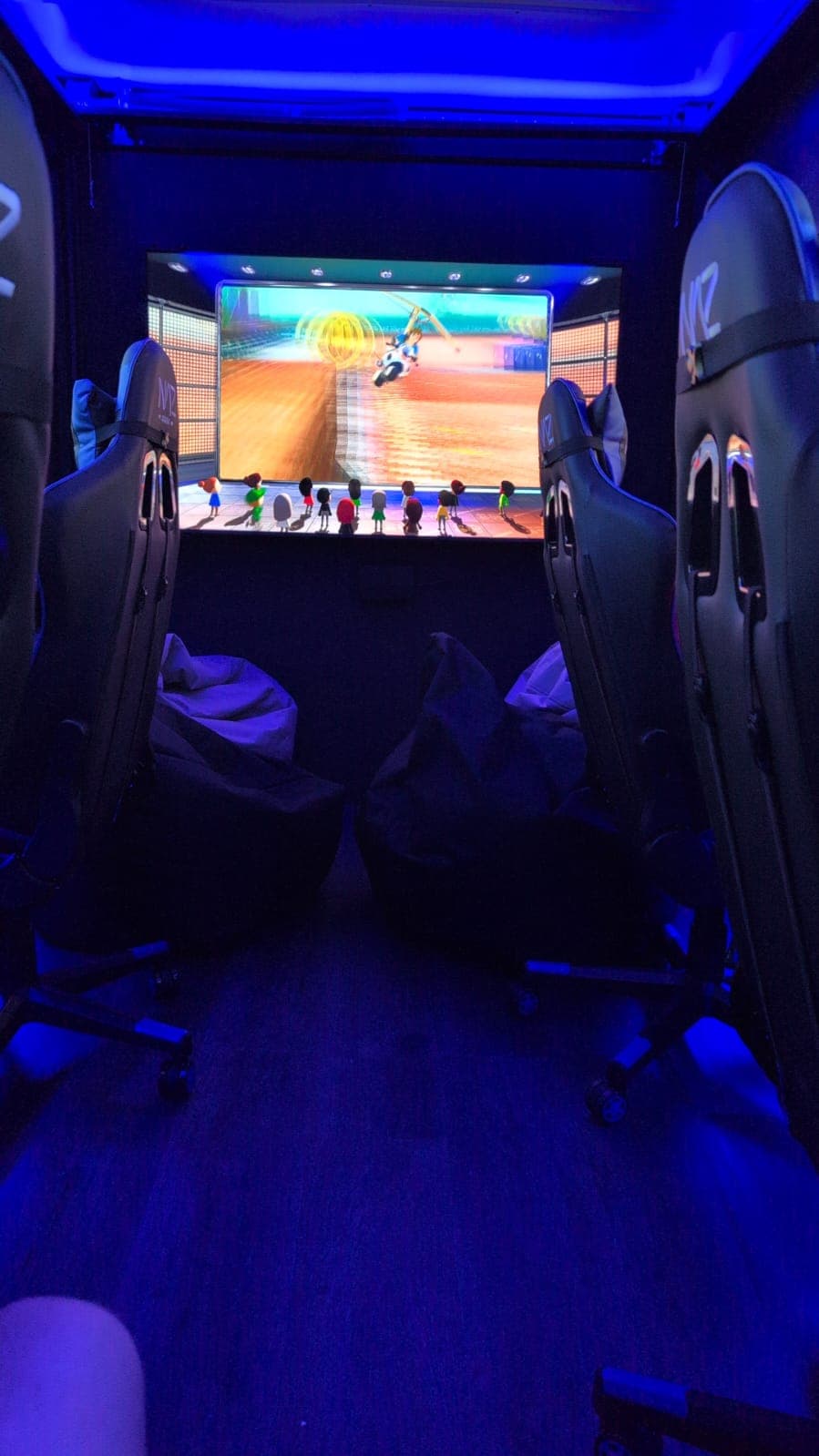 Large TV screen gaming setup